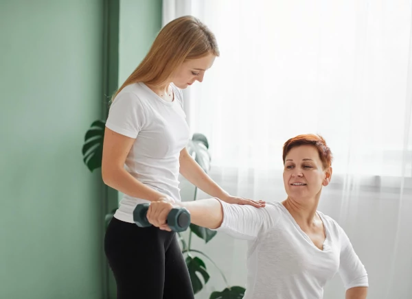 Rehabilitation - elder-woman-doing-physical-exercises-with-dumbbell