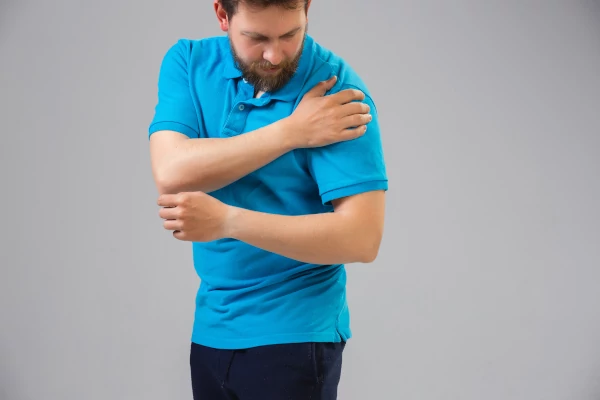 unhappy woman has painful feelings in left shoulder, - shoulder pain